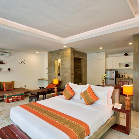 Mane Village Suites Siem Reap Exterior foto A bedroom at the hotel