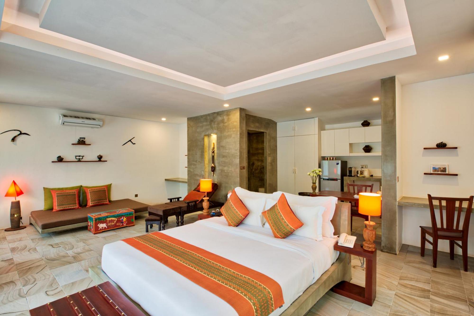Mane Village Suites Siem Reap Exterior foto A bedroom at the hotel